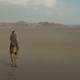 Obi-Wan rides his Eopie across the Tatooine desert.
